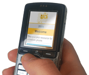 Mobile phone with website visible.